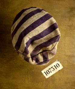 The cap of a prison uniform and a number patch worn by concentration camp prisoner Karel Bruml at Auschwitz and Nordhausen. Both were issued to him in Auschwitz, 1941-5.