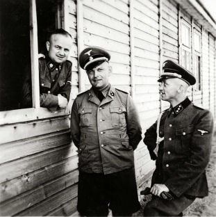 Close-up portrait of three SS officers in Gross-Rosen, 1941.